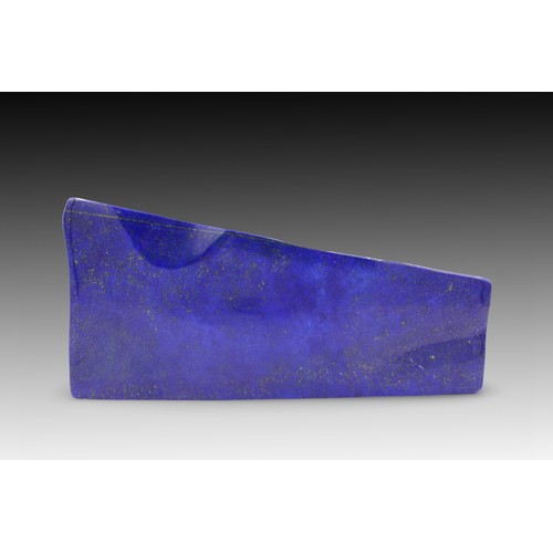 113 - An Afghan Polished Lapis Lazuli Decorative Piece from the 20th Century.

Length: Approximately 24cm
... 