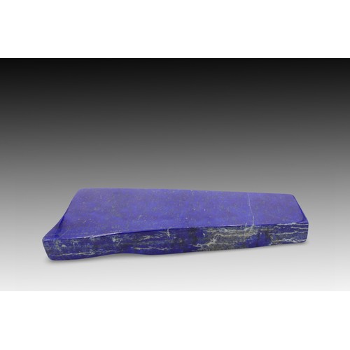 113 - An Afghan Polished Lapis Lazuli Decorative Piece from the 20th Century.

Length: Approximately 24cm
... 