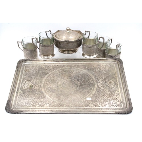 124 - An Islamic Persian Silver Tea set from the 19th Century

Weight: 1266g
Tray size: 
Width: Approximat... 