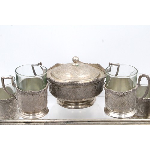 124 - An Islamic Persian Silver Tea set from the 19th Century

Weight: 1266g
Tray size: 
Width: Approximat... 