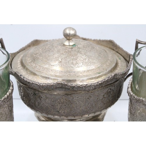 124 - An Islamic Persian Silver Tea set from the 19th Century

Weight: 1266g
Tray size: 
Width: Approximat... 