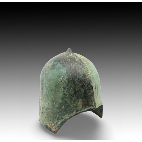 142 - An Ancient Roman Helmet with Lovely Patina

Height: Approximately 23cm