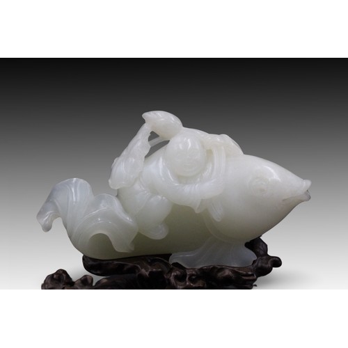 215 - A Chinese White Jade Carving from the Qing Dynasty of a Boy on Fish 

Private Collector in Belgium