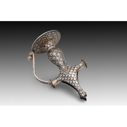 290 - An Indian Sikh Sword Handle with Silver Plated Work.

Length:  Approximately 19cm