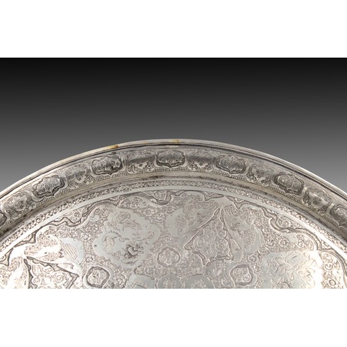 394 - A Persian Silver Tray with Beautiful Carving

Diameter: Approximately 28cm

Weight: 535g