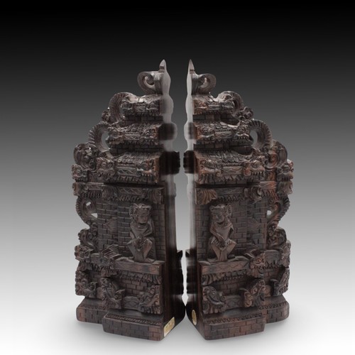 434 - An Indonesian Handcrafted Hardwood Bookends.

Height: Approximately 30cm
Length: Approximately 23.5c... 