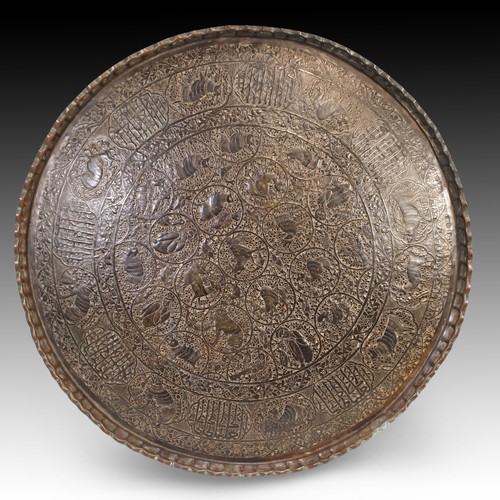 118 - An Indo-Persian Metal Tray from the 19th Century Featuring Intricate Animal Figure Carvings and Arab... 