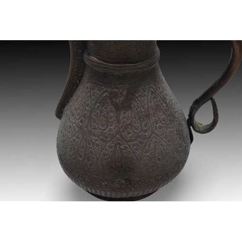 280 - An Indian Kashmiri Water Jug Adorned with Elaborate Carvings.

Height: Approximately 32 cm.