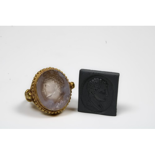 445 - A Gold Ring with White Chalcedony Agate Intaglio of the Head of a Roman Deity

Ring Size: US7.25 UK1... 