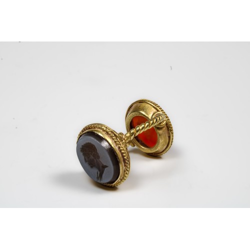 447 - A Gold Double Headed Intaglio Ring Representing Tyne in Red Carnelian on One Head and a Cameo Intagl... 