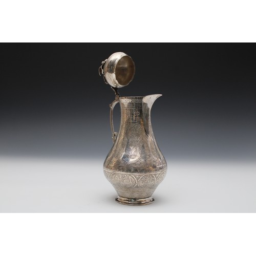 9 - An Islamic Silver Coffee Pot Decorated with Islamic Calligraphy with Rose and Bird Finial.

H: Appro... 