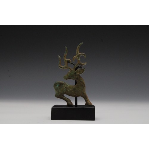 406 - A Luristani Bronze Plaque in the Shape of a Deer.

H with Stand: Approximately 13cm
H: Approximately... 