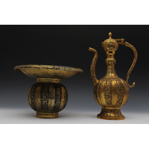 151 - An Indian Brass Aftaba Ewer and Basin with Flower Engraving.

H of Ewer: 37cm
H of Basin: 20cm
D of ... 