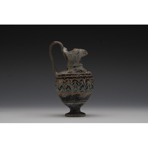 407 - A Glass Amphoriskos (Perfume Bottle) from the Roman Period or Later.

H: Approximately 12cm