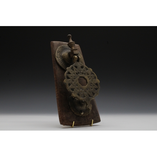 23 - An Islamic Bronze Mamluk Style Door Knocker

L: Approximately 27cm