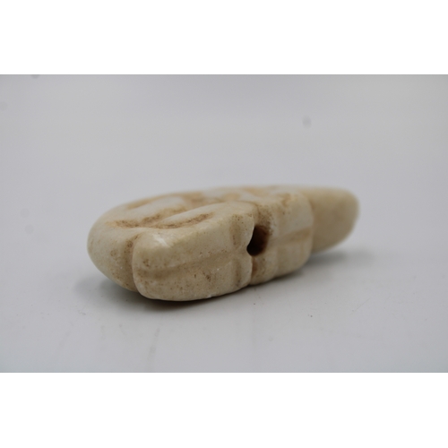 410 - A Jemdet Nasr Crème Alabaster Amulet of a Seated Pig from 2000- 3000 B.C.

L: Approximately 5cm