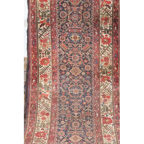 139 - A Persian Shiraz Runner Rug from the 19th Century.

L: Approximately 433cm
W: Approximately 105cm