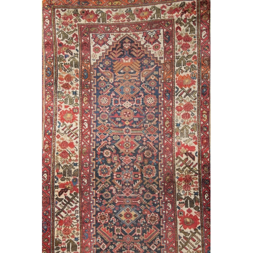 139 - A Persian Shiraz Runner Rug from the 19th Century.

L: Approximately 433cm
W: Approximately 105cm