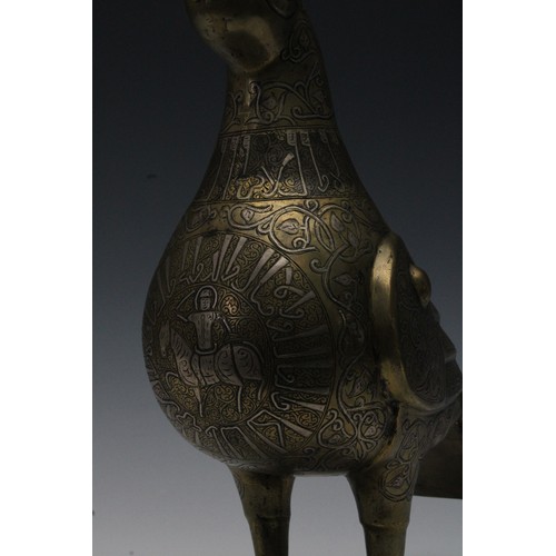 42 - An Islamic Bronze Incense Burner in the Shape of a Bird with Silver Inlay and Islamic Calligraphy.

... 