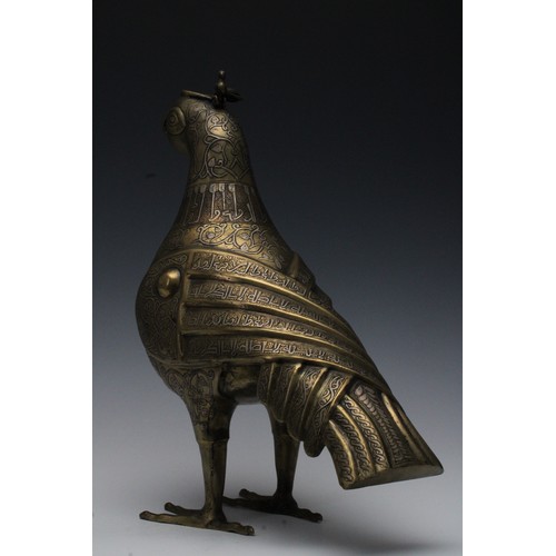 42 - An Islamic Bronze Incense Burner in the Shape of a Bird with Silver Inlay and Islamic Calligraphy.

... 