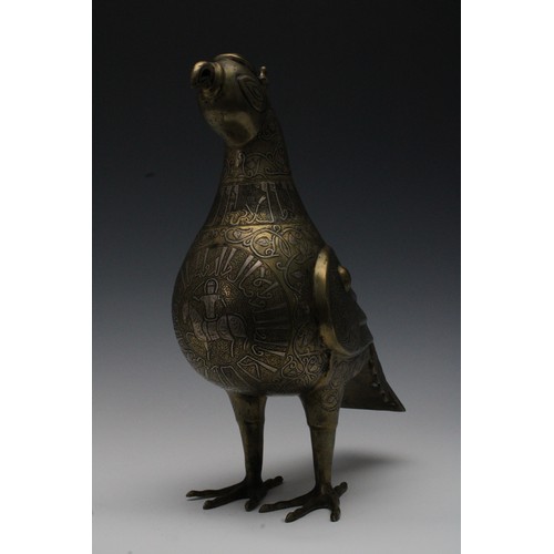 42 - An Islamic Bronze Incense Burner in the Shape of a Bird with Silver Inlay and Islamic Calligraphy.

... 