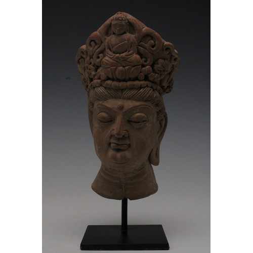 417 - A Rare Terracotta Head Fragment Possibly Ancient on a Black Metal Base.

H: Approximately 22cm