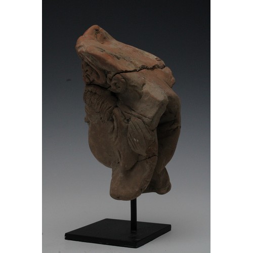 417 - A Rare Terracotta Head Fragment Possibly Ancient on a Black Metal Base.

H: Approximately 22cm