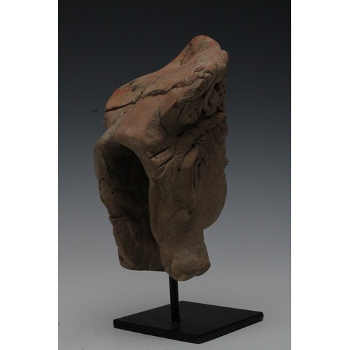 417 - A Rare Terracotta Head Fragment Possibly Ancient on a Black Metal Base.

H: Approximately 22cm