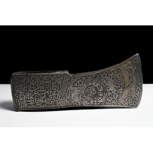 59 - An Islamic Indian/ Persian Iron Tabar Battle Axe with Islamic Calligraphy and Floral and Animal Desi... 