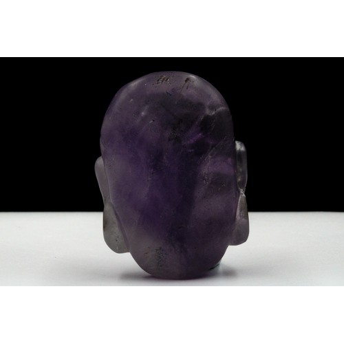 419 - A Rare Middle Eastern Amethyst Carved Head.

H: Approximately 5.4cm