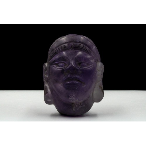 419 - A Rare Middle Eastern Amethyst Carved Head.

H: Approximately 5.4cm