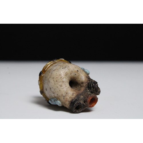 425 - A Glass Head Pendant in the Style of Roman or Phoenicia Levant Area.

H: Approximately 4.2cm