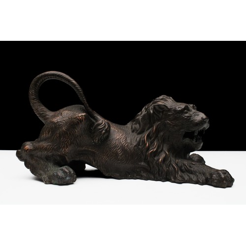 463 - A Bronze Figure of a Lion.

L: Approximately 23cm