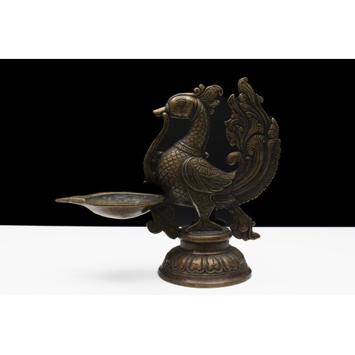 174 - An Indian Bronze Oil Lamp in the Shape of a Bird.

H: Approximately 19cm