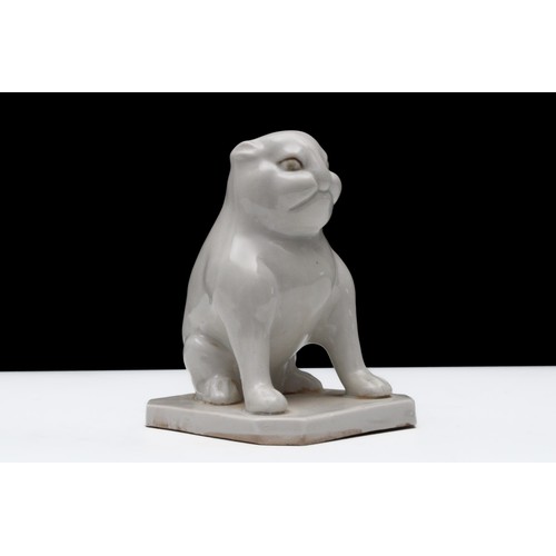 297 - A Chinese White-Glazed Porcelain Figure of a Seated Dog.

H: Approximately 10.5cm