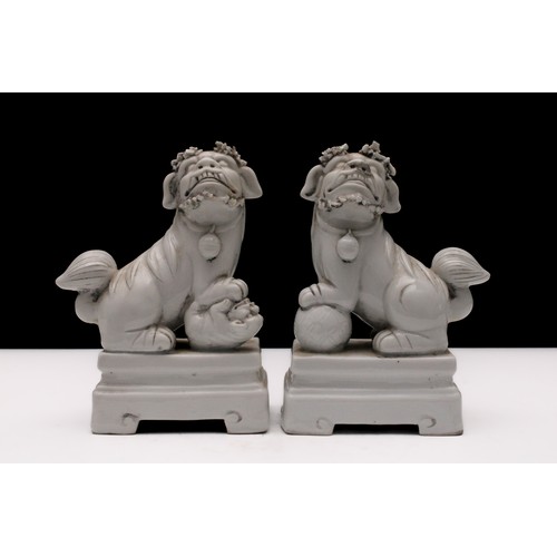 309 - A Pair of Chinese Porcelain Figures of Dogs with a Ball and a Puppy Under Their Feet. 

H: Approxima... 