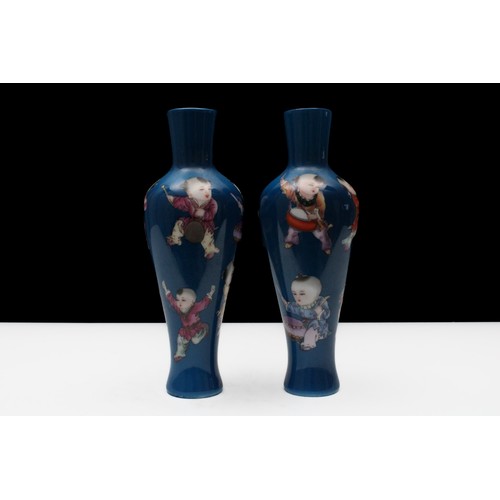 310 - A Pair of Chinese Blue Ground Famille Rose Vases Depicting Children Playing Instruments and Dancing ... 