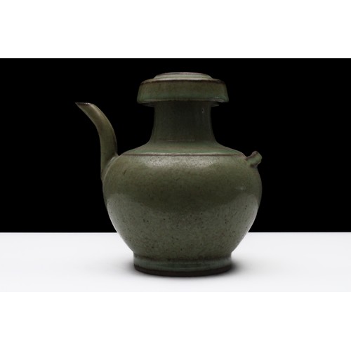 318 - A Rare Chinese Celadon- Glazed Jug with 2 Joint Spouts.

H: Approximately 17cm