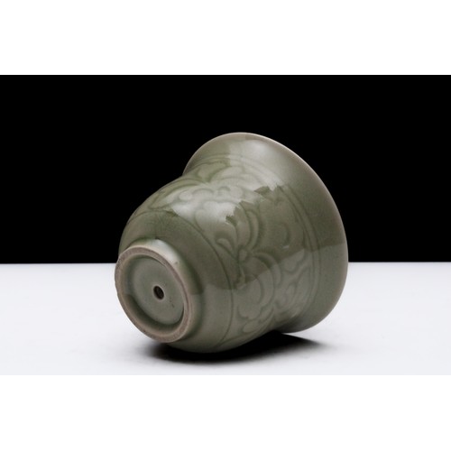 321 - A Chinese Celadon Porcelain Vessel with a Dragon Inside.

H: Approximately 9.5cm