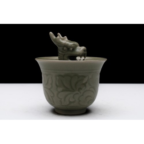 321 - A Chinese Celadon Porcelain Vessel with a Dragon Inside.

H: Approximately 9.5cm