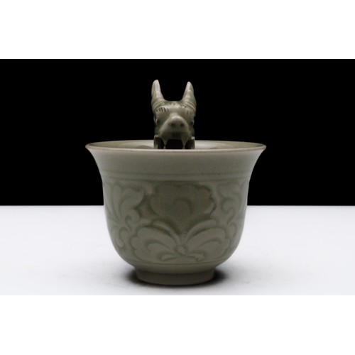 321 - A Chinese Celadon Porcelain Vessel with a Dragon Inside.

H: Approximately 9.5cm