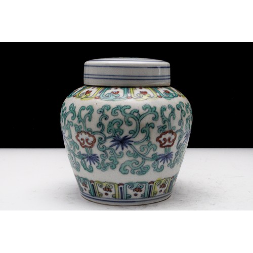 326 - A Rare Chinese Porcelain Jar with Lid Decorated with Floral Patterns.

H: Approximately 11cm