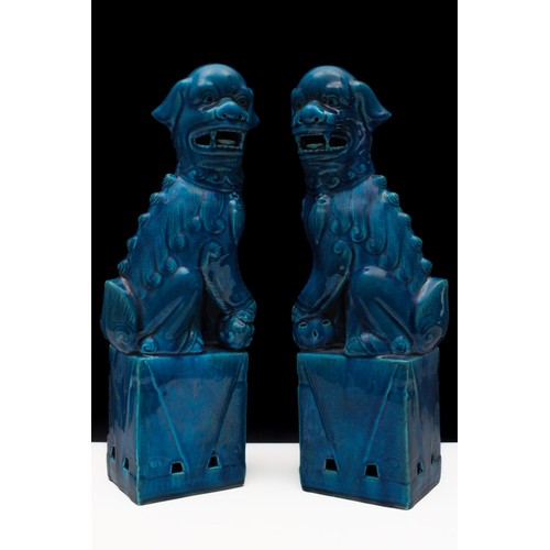 327 - A Pair of Chinese Porcelain Turquoise Figures of Foo Dogs.

H: Approximately 33cm