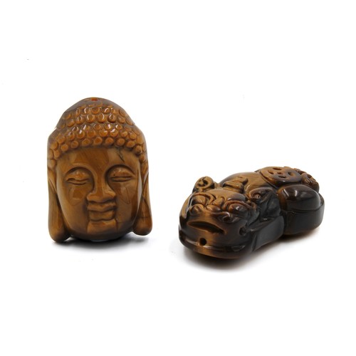 369 - A Lot of 2 Chinese Tiger's Eye Stone Pendants in the Shape of a Buddhist Deity and a Dragon.

L: App... 