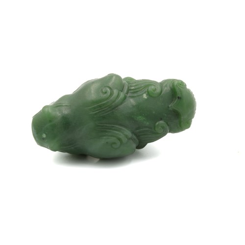 372 - A Chinese Green Jade Pendant Depicting a Dragon's Head.

L: Approximately 5cm