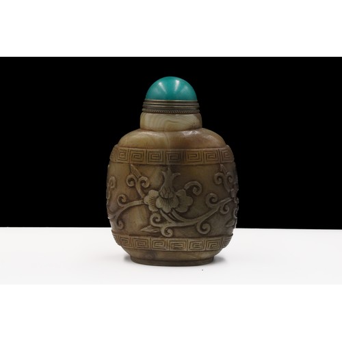 376 - A Rare Chinese Agate Snuff Bottle with Intricate Floral Patterns.

H: Approximately 8cm