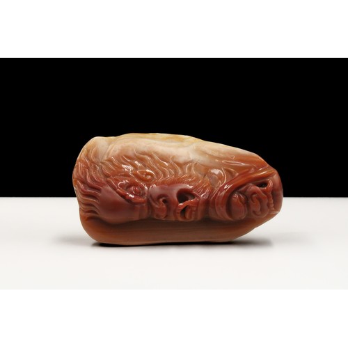 379 - A Chinese Agate Hand Carved Pendant Depicting a Dragon.

H: Approximately 7cm