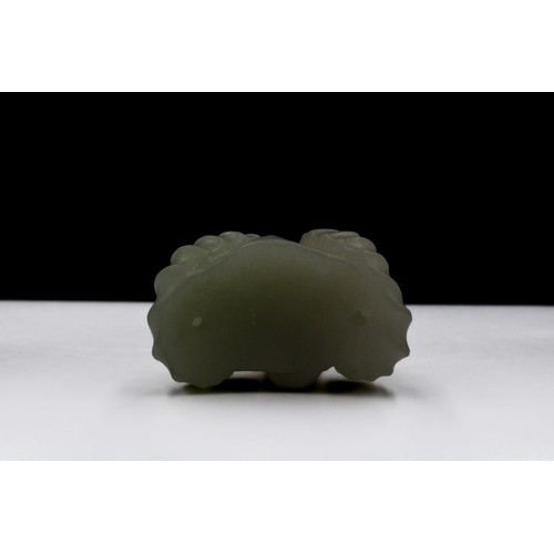 381 - A Chinese Jade and Hand Carved Pendant of a Sheep with Horns.

H: Approximately 2.5cm