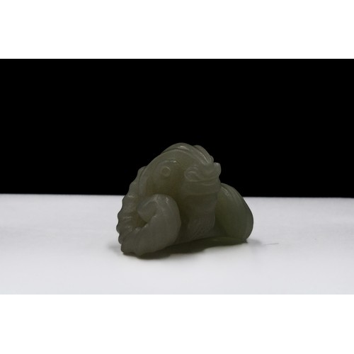 381 - A Chinese Jade and Hand Carved Pendant of a Sheep with Horns.

H: Approximately 2.5cm