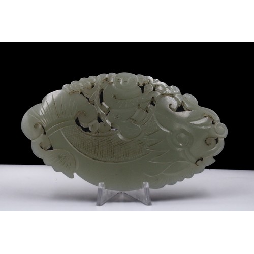 385 - A Chinese Large Hand Carved Jade Plaque with Intricate  Openwork Depicting a Man on a Fish.

L: Appr... 